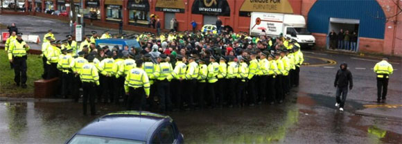 Young celtic fans being 'kettled' on their way to a football match. Scotland, March 2013.